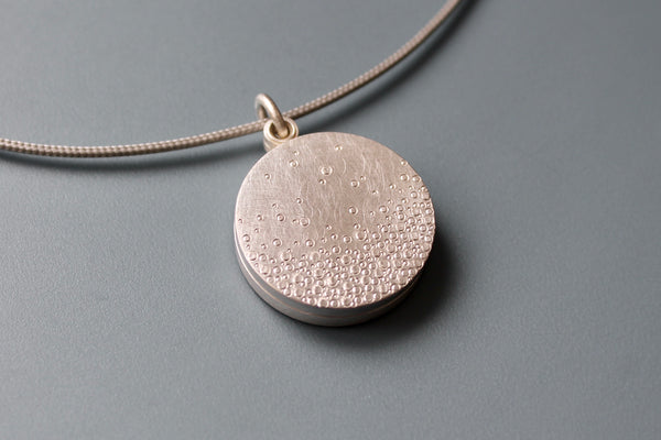 modern double photo locket in sterling silver with bubbles design