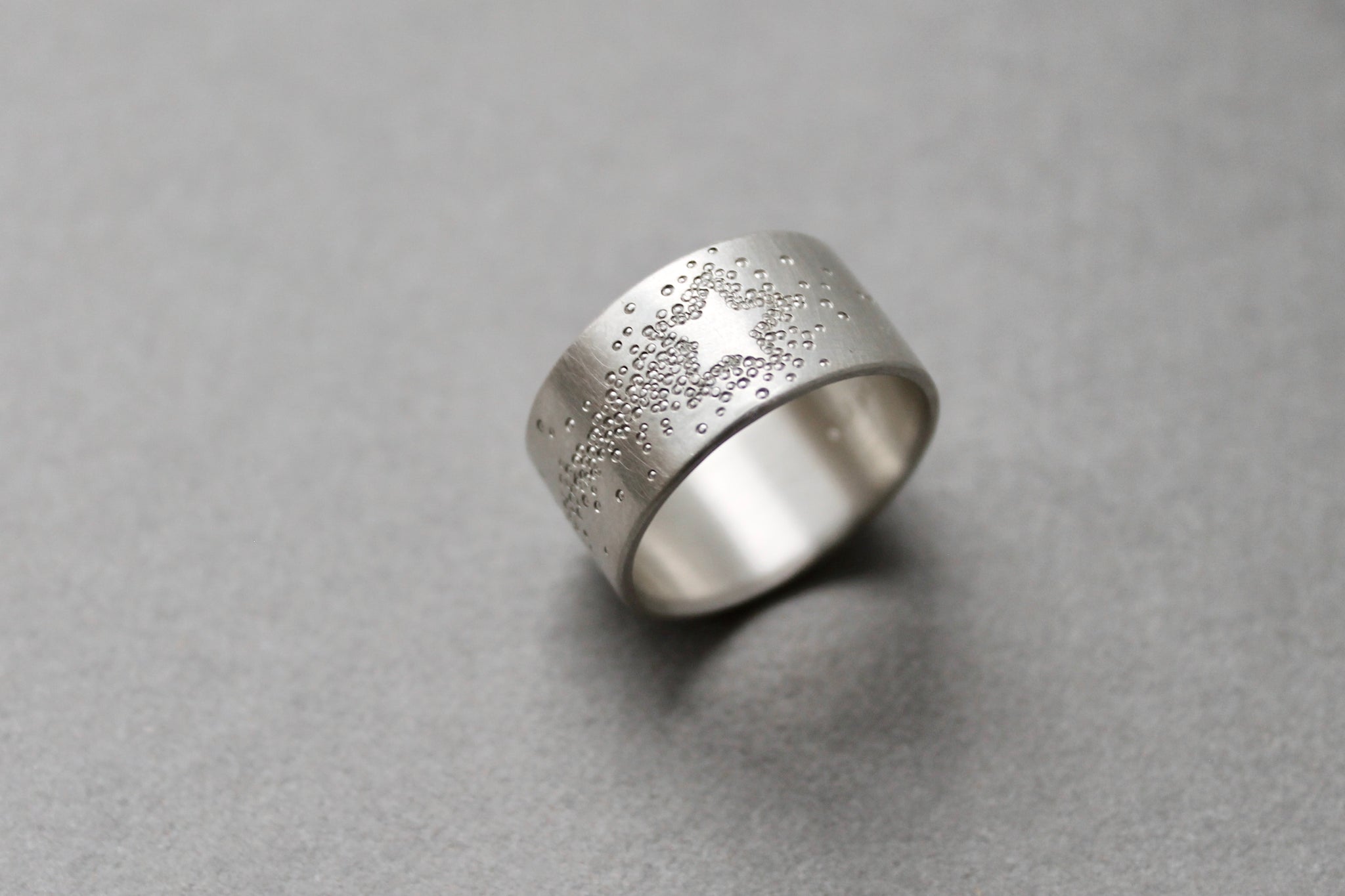 wide silver band ring with shooting star design