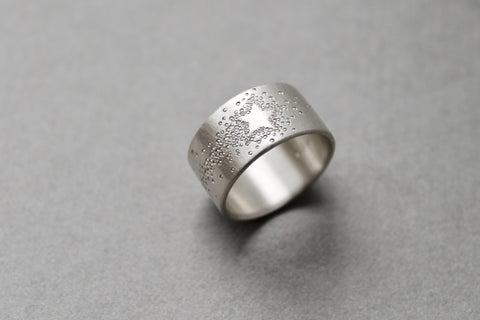 wide silver band ring with shooting star design
