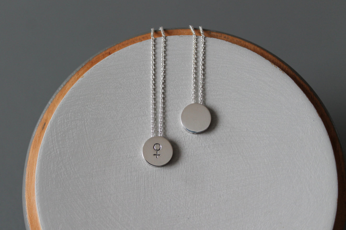 minimalist silver necklace with venus symbol