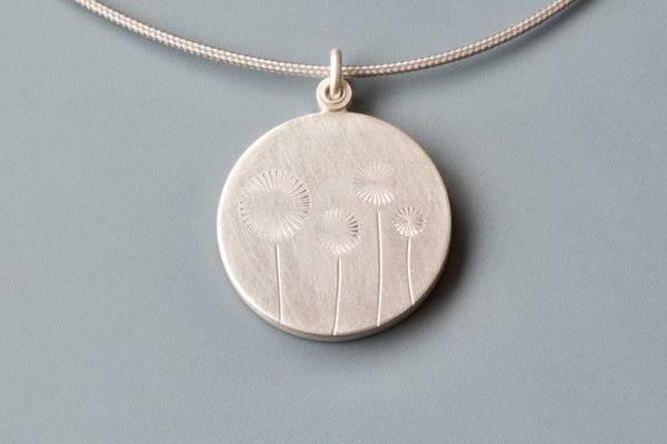 lovely locket for one photo with four dandelions