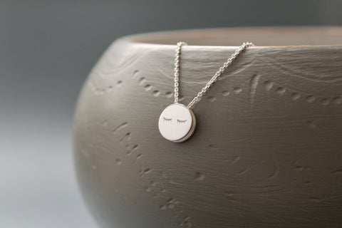fun necklace with sleepy eyes pendant in sterling silver