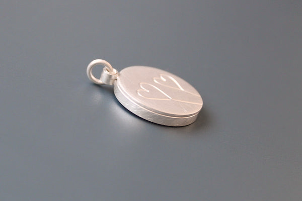 romantic silver photo locket with symbolic two hearts design