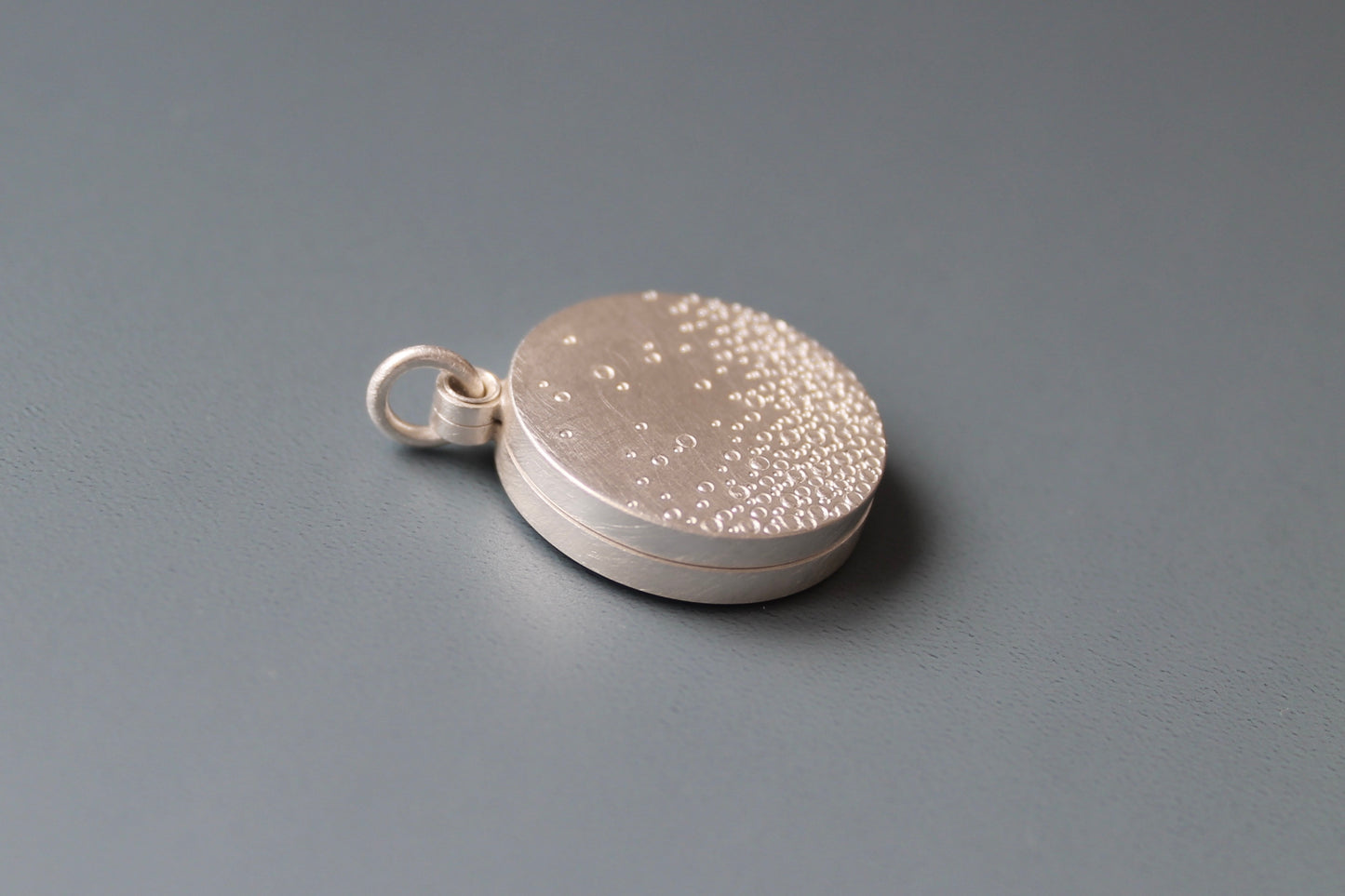 modern double photo locket in sterling silver with bubbles design
