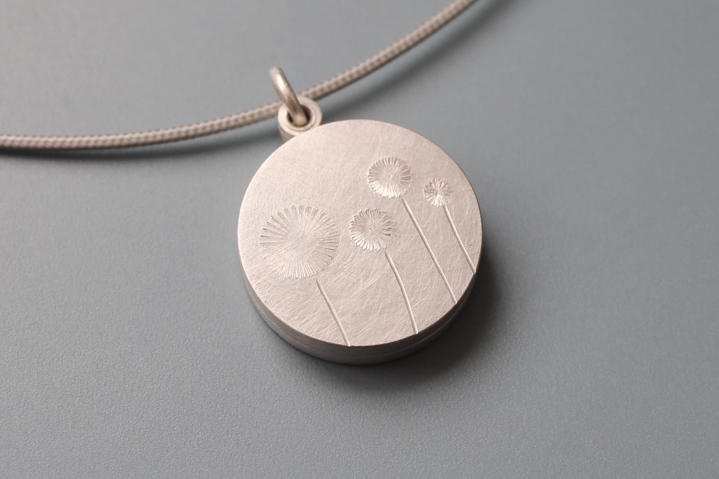 double photo locket with four dandelions in sterling silver