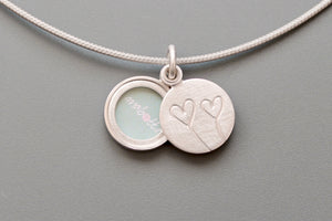 tiny romantic sterling silver photo locket with two hearts
