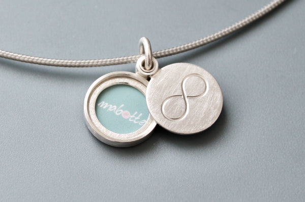 minimalist silver infinity locket for one picture