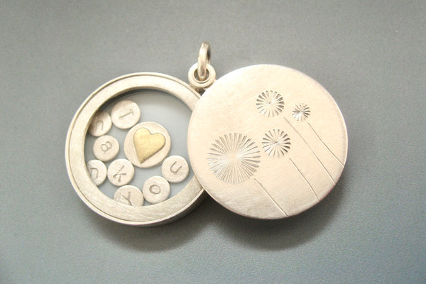 sterling silver floating dandelion locket filled with stamped letter plates