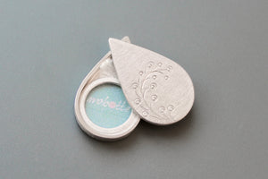 elegant drop shaped locket with twig design in sterling silver