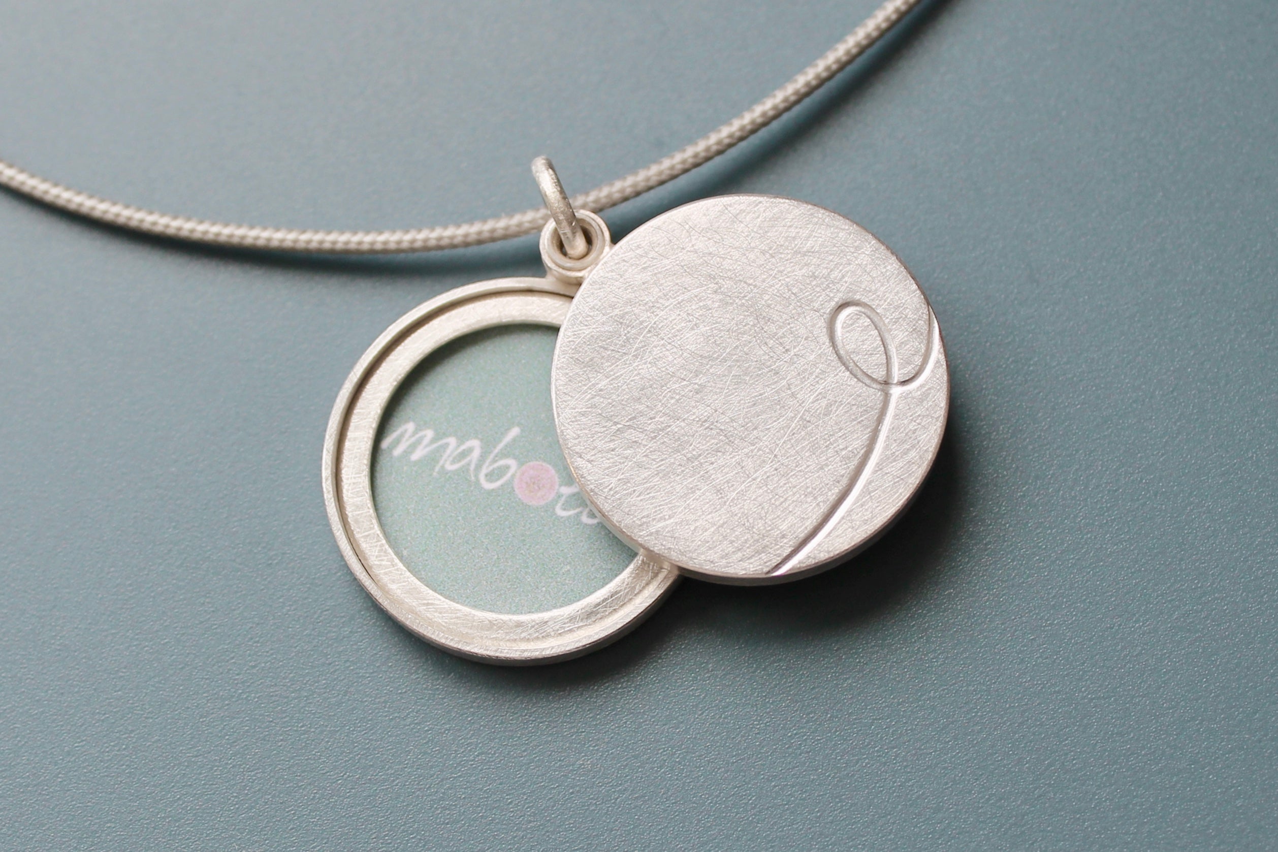custom initial locket for two photos in sterling silver – mabotte