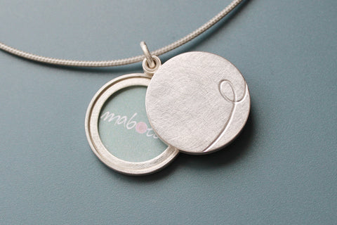 custom initial locket for two photos in sterling silver