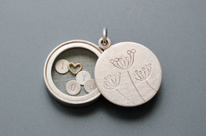 secret message locket filled with letter plates and a golden heart