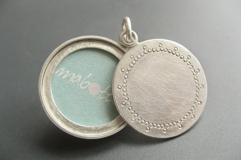modern silver photo locket with delicate lace pattern