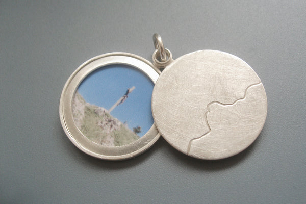 minimalist photo locket with mountain range handmade in sterling silver