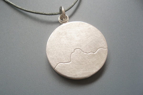 minimalist photo locket with mountain range handmade in sterling silver