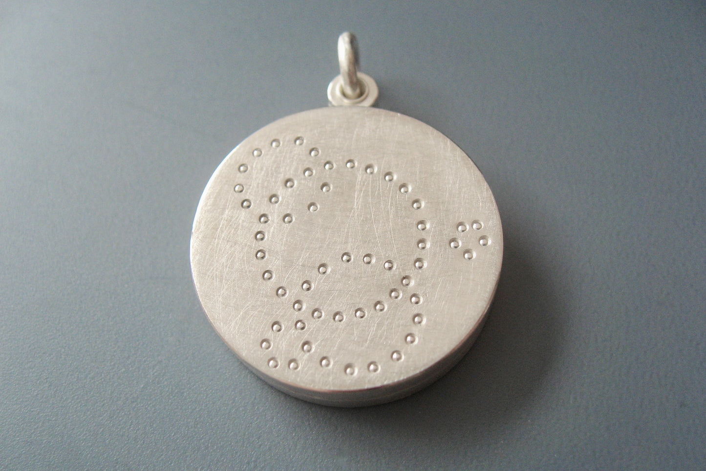 contemporary locket for two pictures handmade in sterling silver