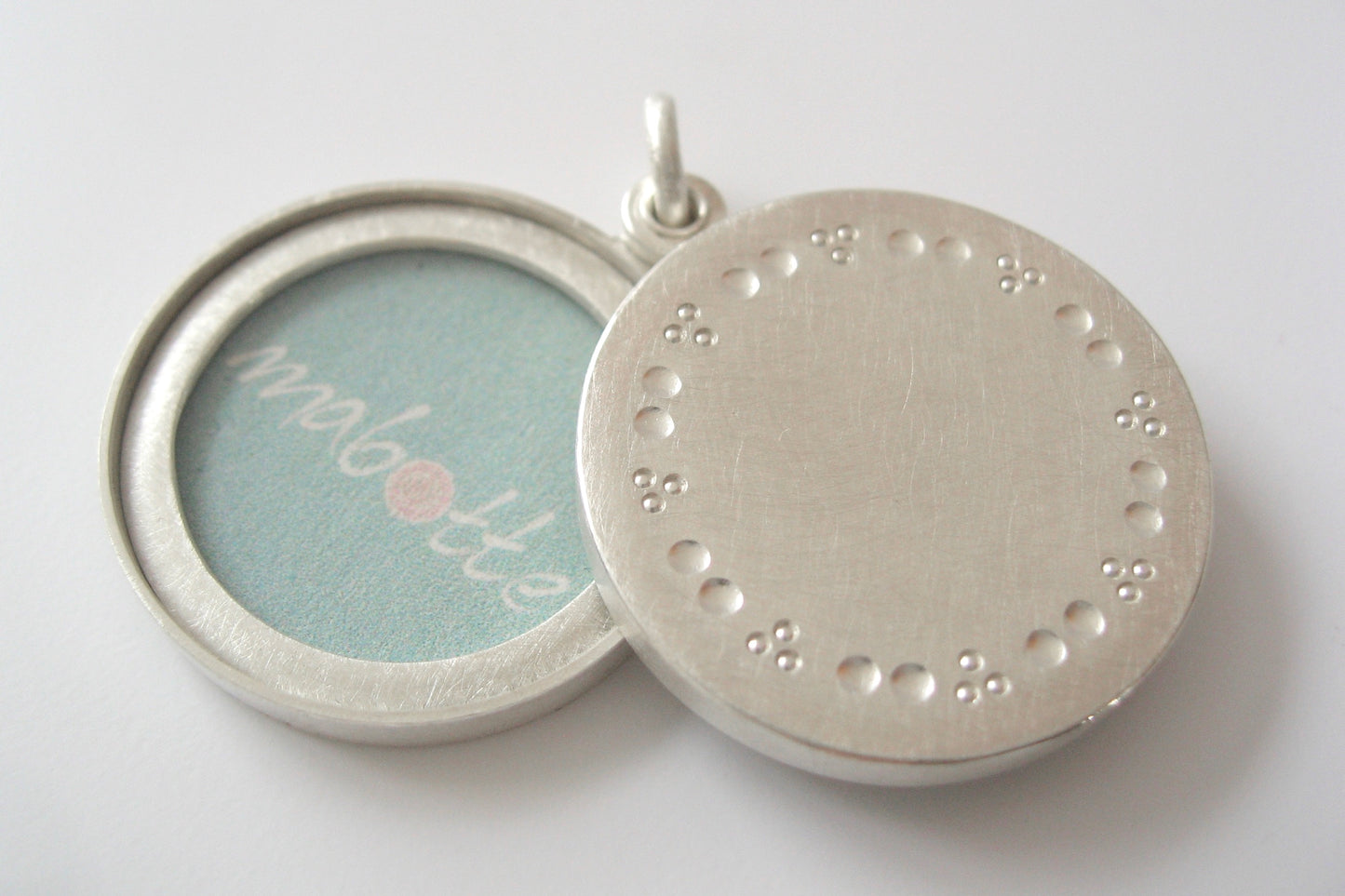 elegant solid silver locket for two pictures with dots pattern