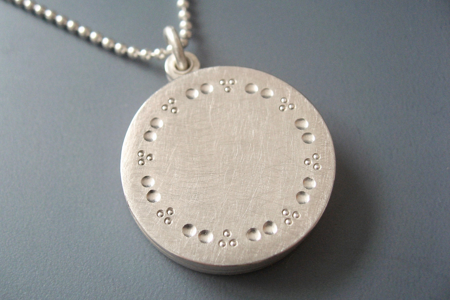 elegant solid silver locket for two pictures with dots pattern