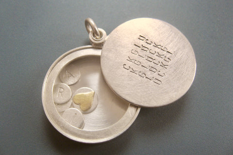 custom glass locket with floating name plates in sterling silver with typographic design