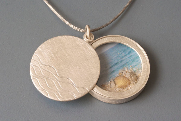 maritime floating locket filled sand and seashells handmade in sterling silver