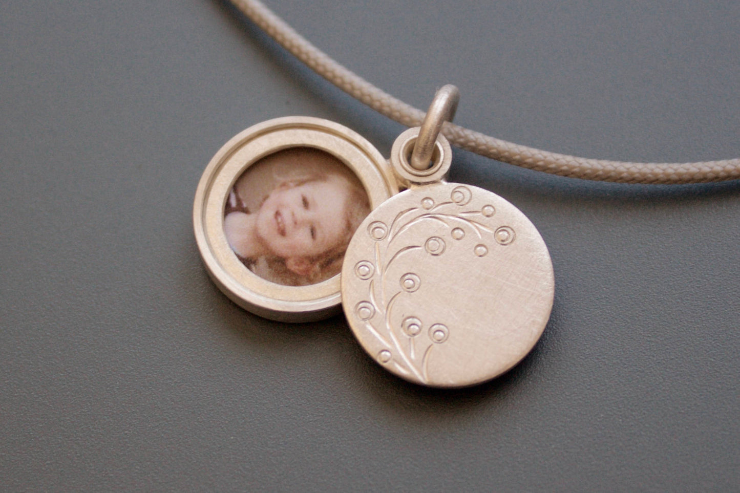 dainty round photo pendant with delicate twig in sterling silver