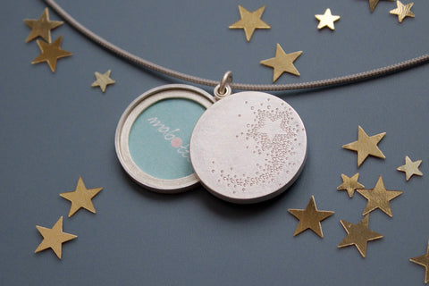wish locket for two photos with shooting star design in sterling silver