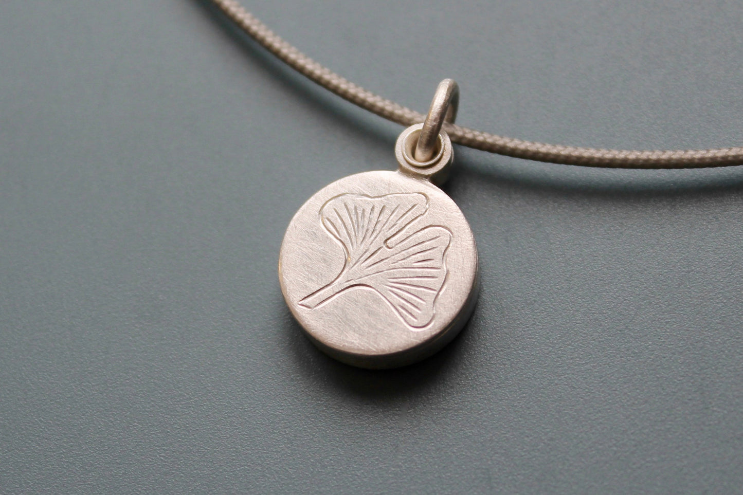 small sterling silver picture locket with gingko leaf