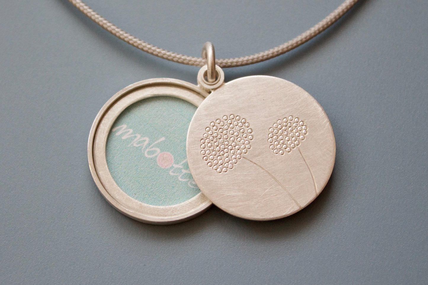 elegant round dandelion locket for one photo in sterling silver