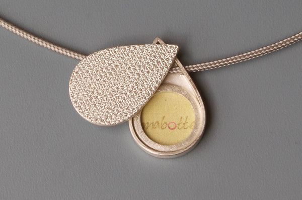 small drop shaped picture locket in unique textured sterling silver