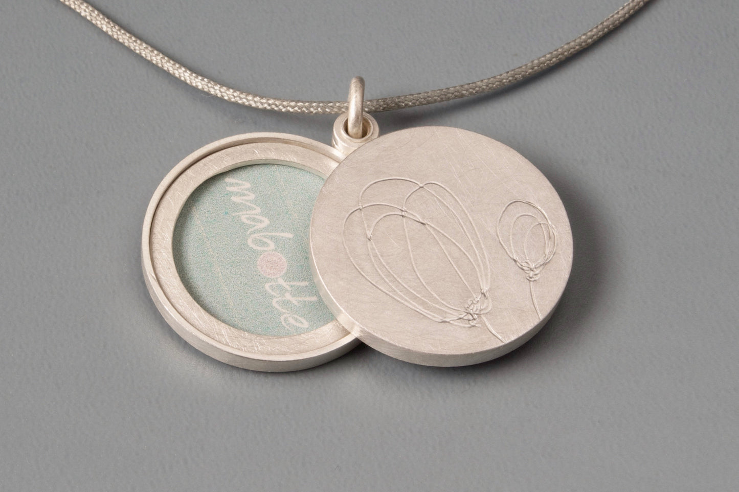 sterling silver double sided locket with tulips