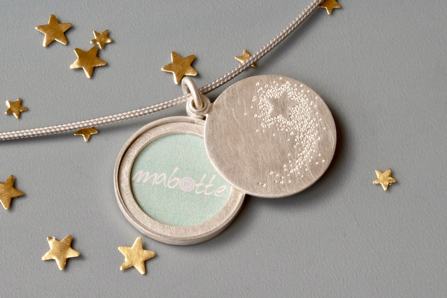 unique picture locket with a shooting star in sterling silver