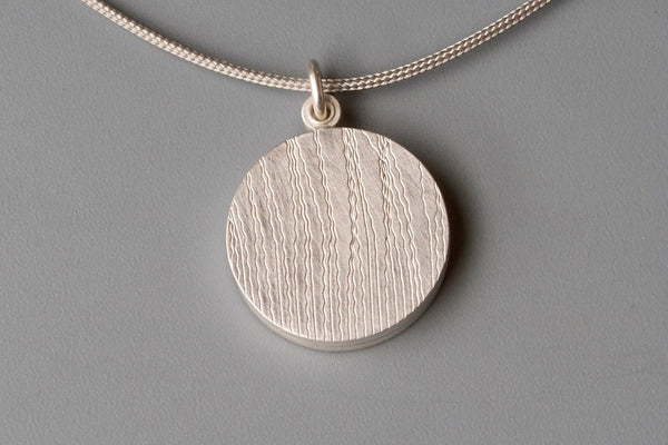 stylish locket for two pictures with grass design in sterling silver