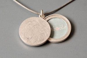 sterling silver double sided locket with tulips
