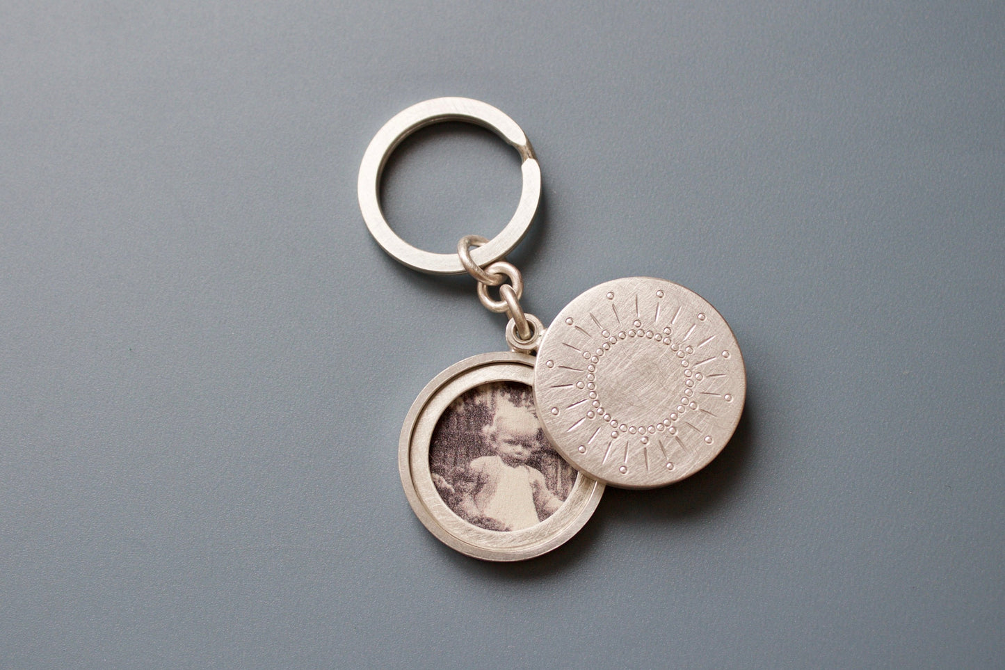 sterling silver keychain locket for two pictures  with sun decor