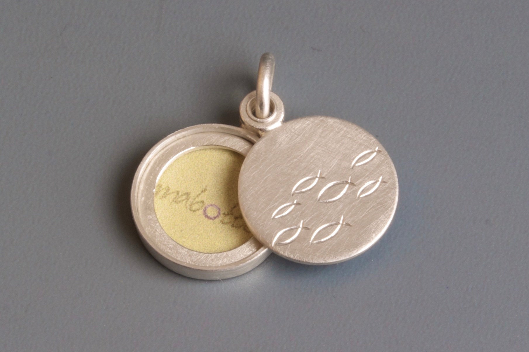 small sterling silver locket for one photo with school of fish
