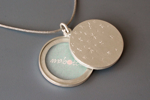 modern sterling silver locket for two photos with stars
