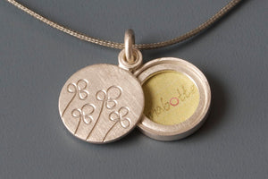 floral silver locket for a small photo with field of flowers design