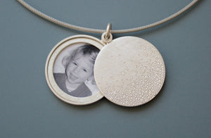 modern photo locket in sterling silver with bubbles design