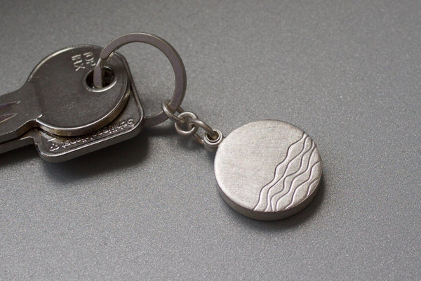 minimalist silver keychain locket with waves for one photo