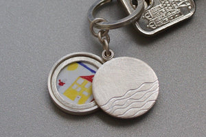 minimalist silver keychain locket with waves for one photo